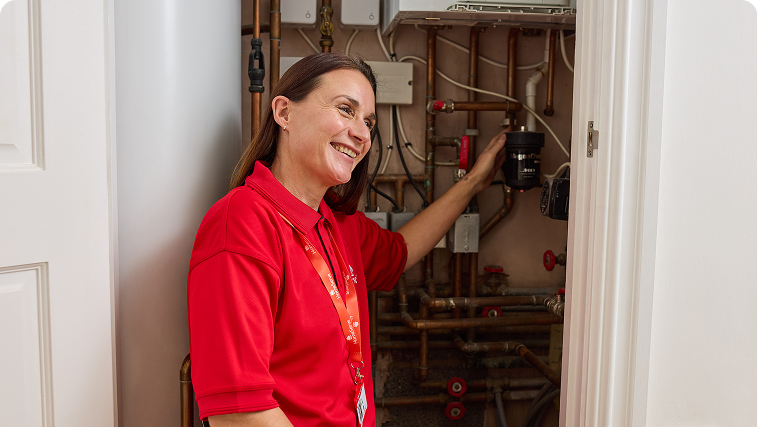 A HomeServe engineer checking a boiler filter during a boiler service.
