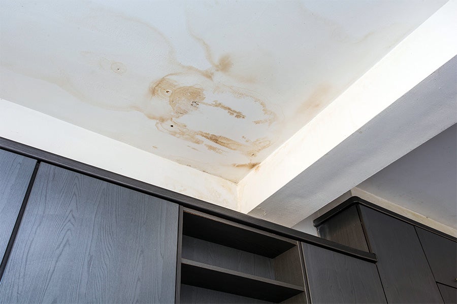 Water damage on a ceiling from a hidden leak.