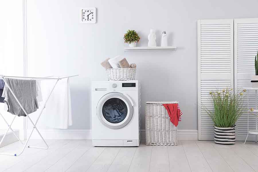 What to turn off before your holiday - checklist [image of washing machine]