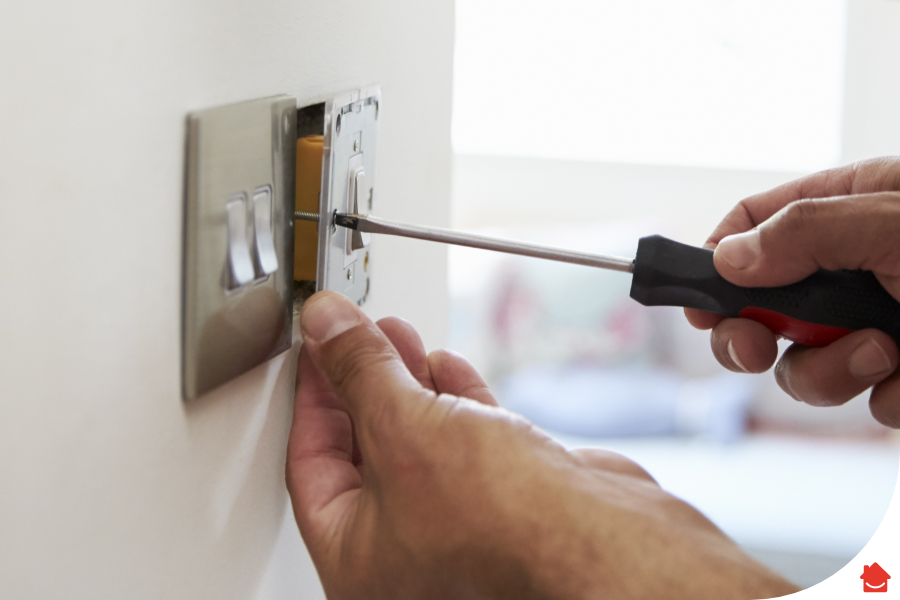 Man changing light switch - How to replace a light switch
