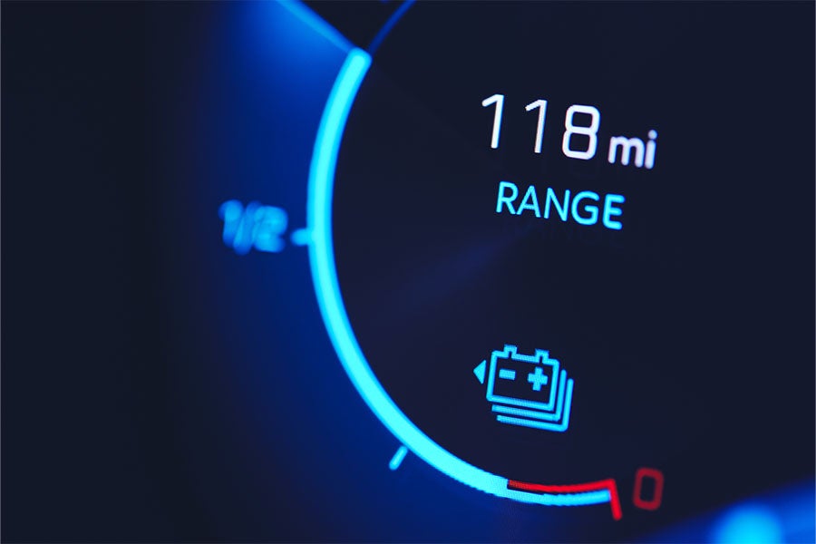 A speedometer on an electric car showing the driving range left in the battery