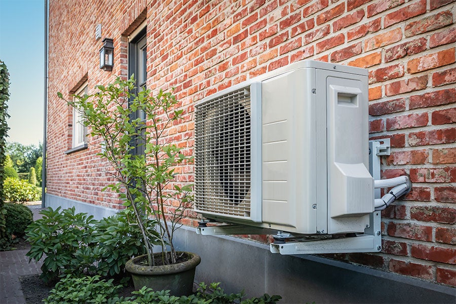 An air source heat pump outside of a home