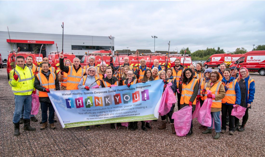 HomeServe employees volunteering to improve Walsall green spaces, posed for a group photo.